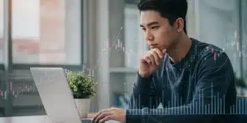 Student contemplating 2026 US student loan interest rates on a laptop with financial data.